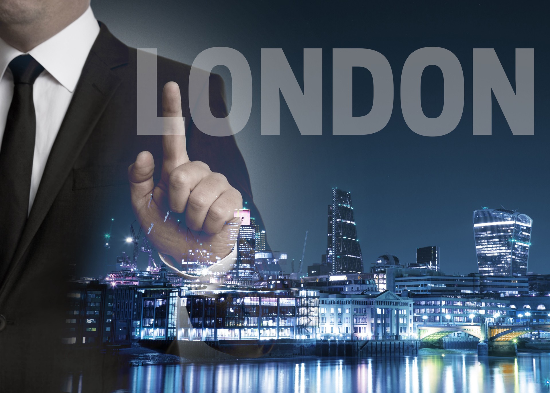 London skyline at night with businessman concept